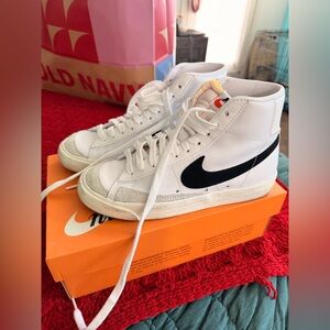 Nike White High-Top Sneakers with Black Swoosh